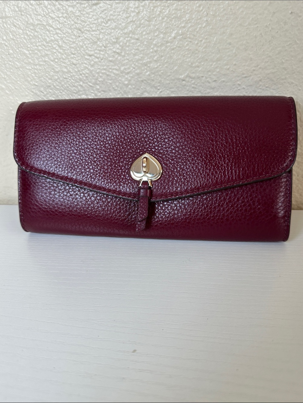 NWOT kate spade Burgundy Pebble Leather Wallet with Gold Spade Lock